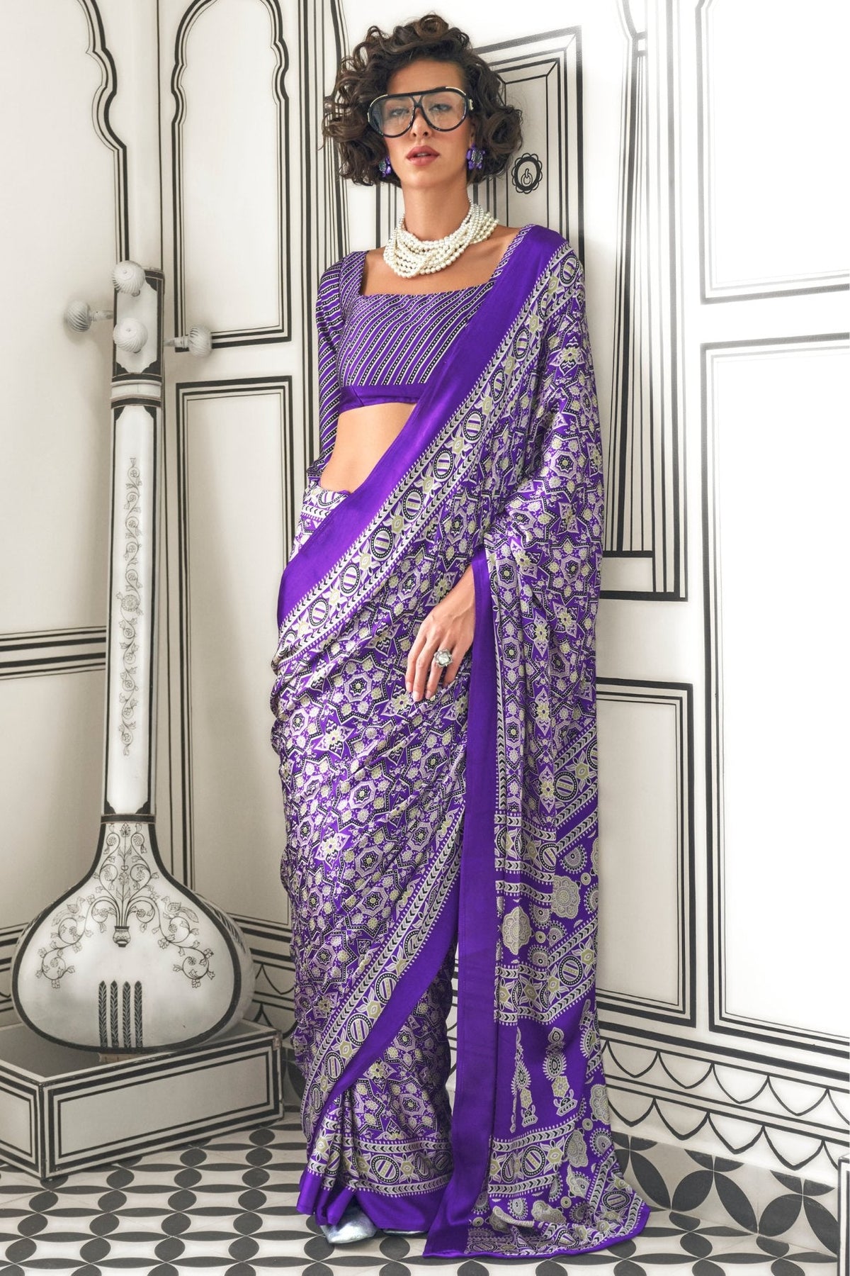 Cyber grape purple Ajrakh-printed satin crepe saree draped to show its fluid fall
