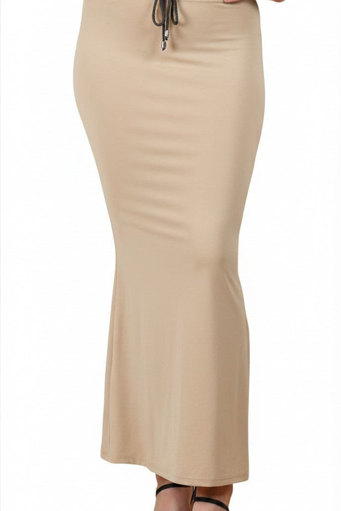 Buy MySilkLove A beige bodycon maxi skirt with a drawstring waist, modeled on a person wearing black strappy heels against a plain white background. Online