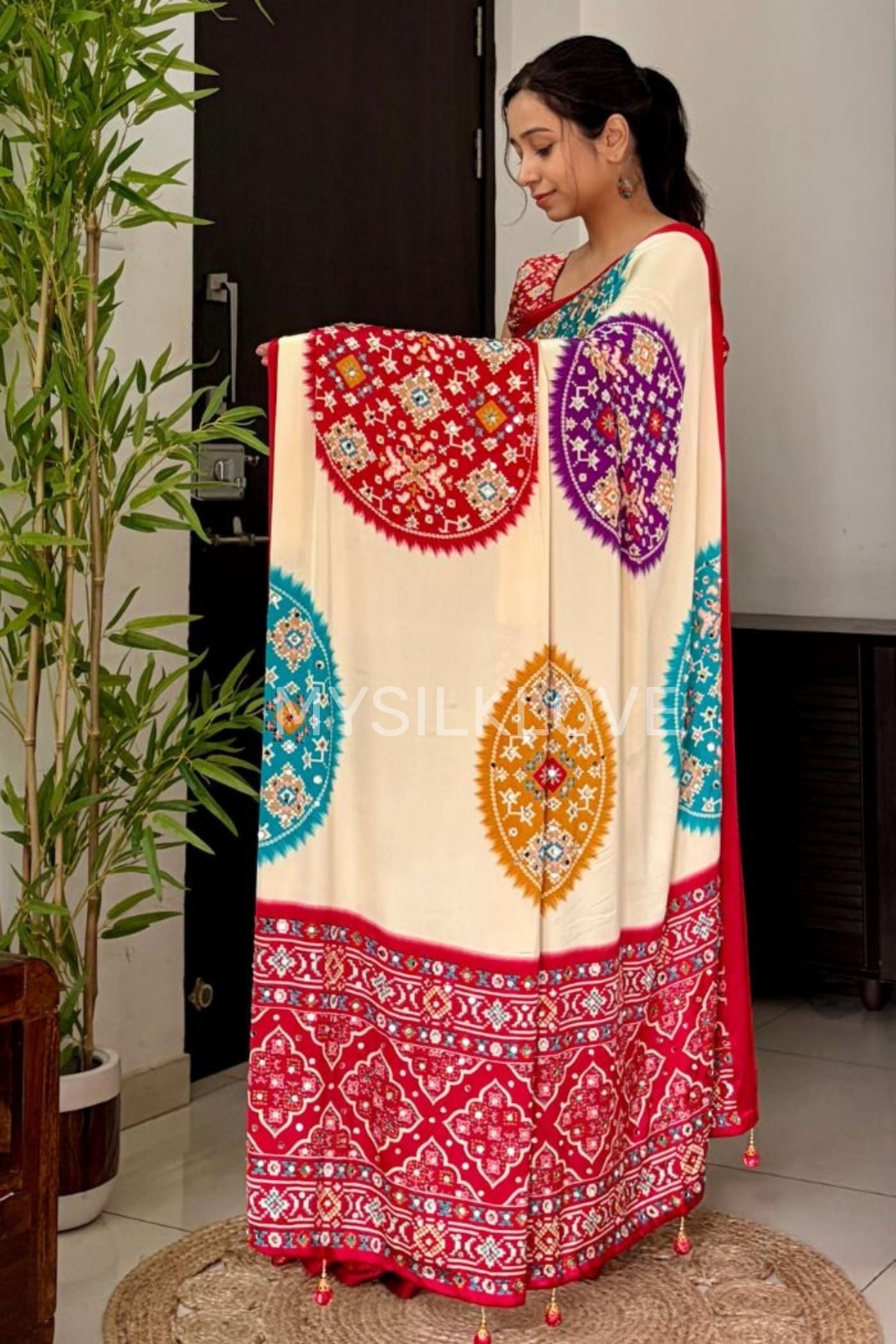 Buy MySilkLove Cookie Cream and Red Modal Ajrakh Satin Printed Mirror Work Saree Without Blouse Online