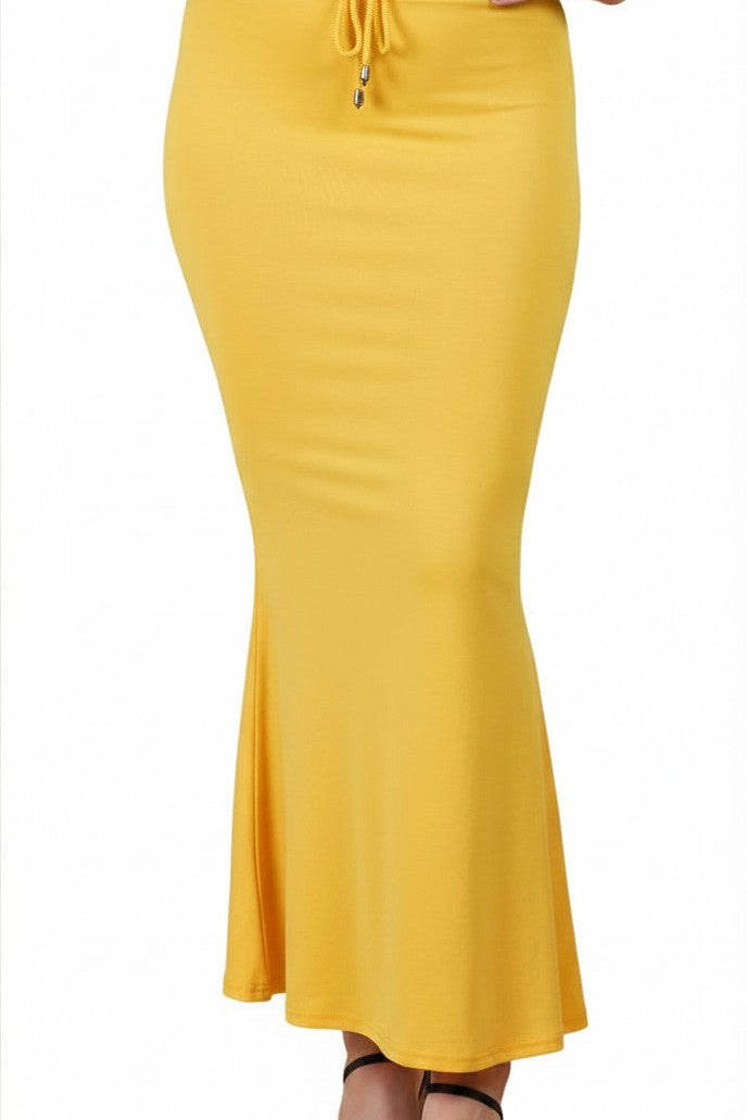 Buy MySilkLove A woman wearing a bright yellow bodycon maxi skirt with a drawstring waist and black strappy heeled sandals, shown against a plain white background. Online